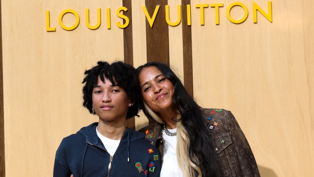 Rocket Williams and Helen Lasichan appear at the Louis Vuitton men’s show