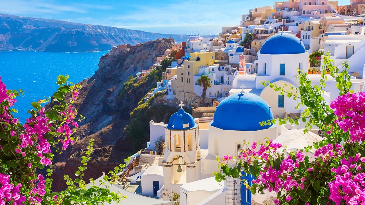 Santorini crowds driven by social media line up at Oia’s blue-domed churches for photos