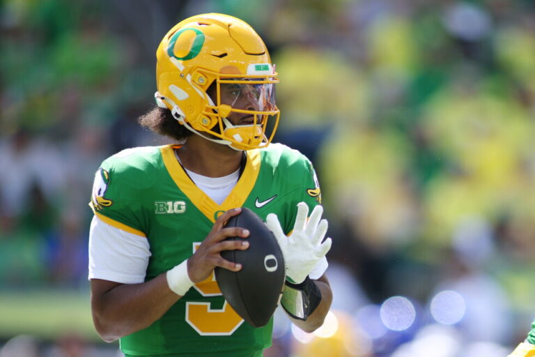 Moore throws for 3 TDs and No. 2 Oregon overcomes a slow start to beat Boise State 34-27